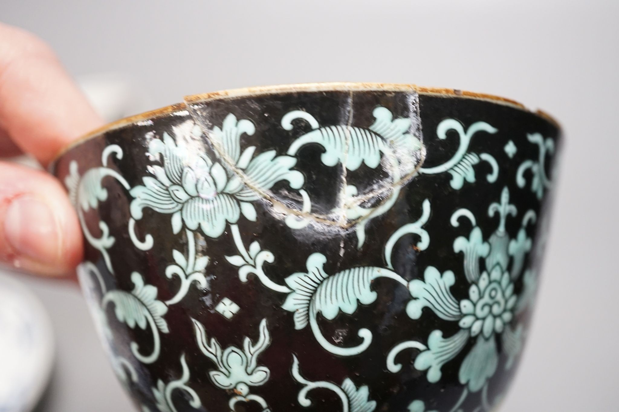A 19th century Chinese black ground porcelain bowls and two covers, together with an three onion pattern blue and white tea bowls and saucers a/f